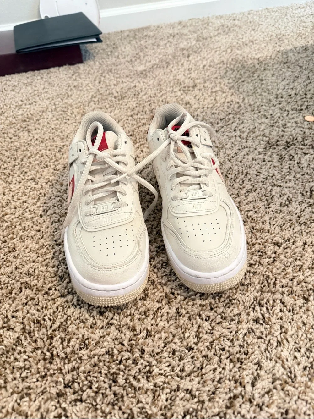 Nike Low-Top Sneakers in Cream with Pink and Red Accents